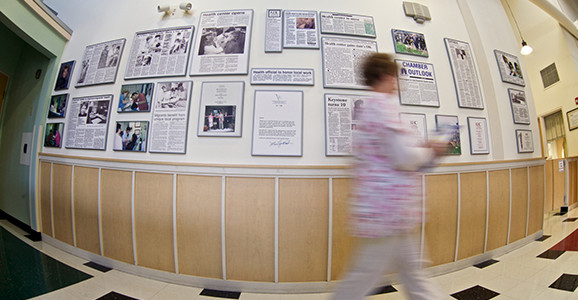 Nurse walking through hallway