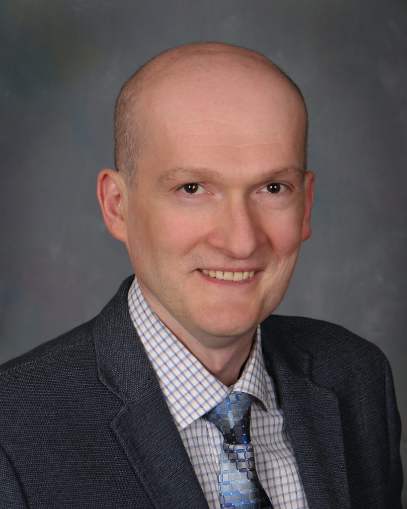 Headshot photo of Dr. Irakli Mania