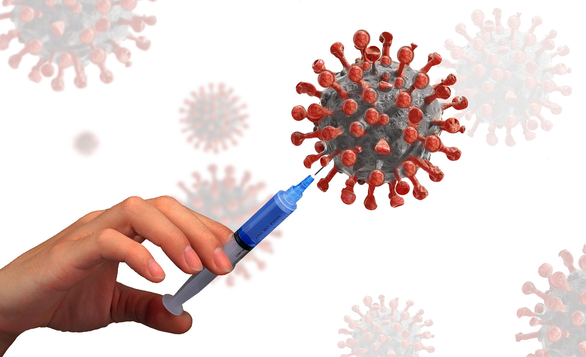 Photo of COVID virus and syringe 